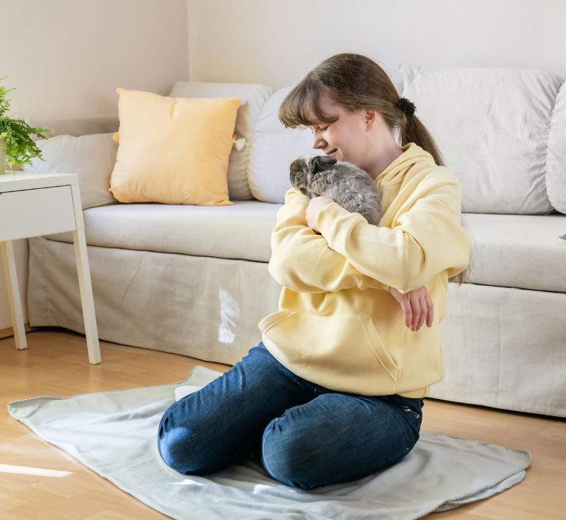 Person Cuddling Emotional Support Animal